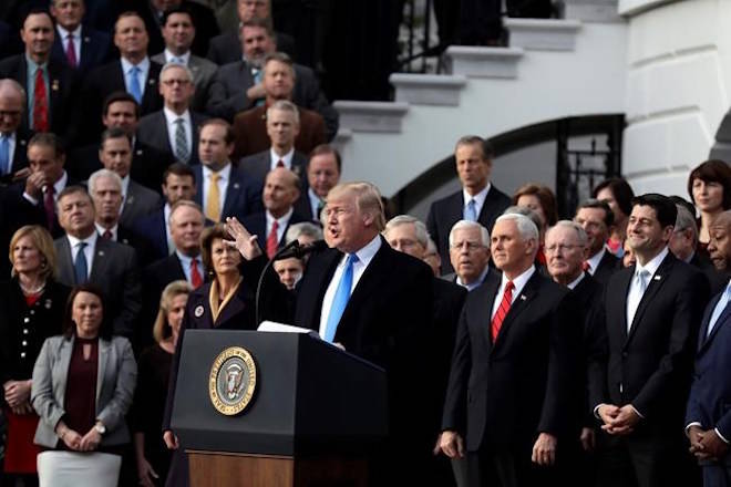 President Donald Trump speaks during a bill passage event on the South Lawn of the White House in Washington, Wednesday, Dec. 20, 2017, to acknowledge the final passage of tax overhaul legislation by Congress. While they have slightly differing views on the landmark tax cuts just adopted in the U.S., and their potential effect on Canada, some of the country’s leading fiscal-policy experts agree on one thing. THE CANADIAN PRESS/AP, Evan Vucci