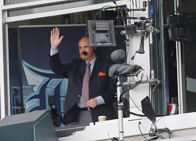 FILE - In this May 21, 2016, file photo, sportscaster Dick Enberg acknowledges the crowd during the first inning of a baseball game between the Detroit Tigers and the Tampa Bay Rays in Detroit. (AP Photo/Carlos Osorio, File)