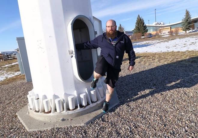 Instructor Chris DeLifle, exits the training tower used by the Lethbridge College Wind Turbine Technician program, Wednesday, November 15, 2017, in Lethbridge, Alberta. THE CANADIAN PRESS/David Rossiter