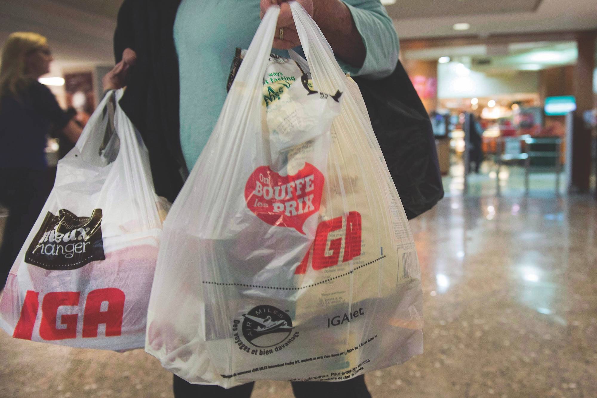 A woman leaves a grocery store Friday, May 15, 2015 in Montreal. FILE PHOTO.THE CANADIAN PRESS/Ryan Remiorz