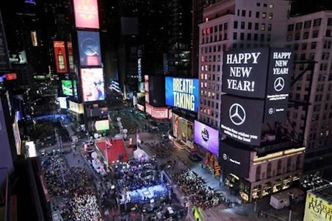 Revelers wait for midnight during New Year’s celebrations in Times Square as seen from the Marriott Marquis in New York, Sunday, Dec. 31, 2017. (AP Photo/Seth Wenig)