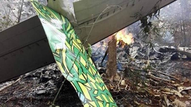 This photo released by Costa Rica’s Civil Aviation press office shows the site of a plane crash in Punta Islita, Guanacaste, Costa Rica, Sunday, Dec. 31, 2017. A government statement says there were 10 foreigners and two Costa Rican crew members aboard the plane belonging to Nature Air, which had taken off nearby. (Costa Rica’s Civil Aviation press office via AP)