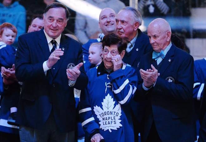 Nancy Bower, wife of the late NHL great Johnny Bower, watches a tribute to her husband with former Toronto Maple Leafs players Frank Mahovlich, left, and Dave Keon prior to NHL hockey action, between the Tampa Bay Lightning and Toronto Maple Leafs in Toronto on Tuesday, January 2, 2018. THE CANADIAN PRESS/Frank Gunn