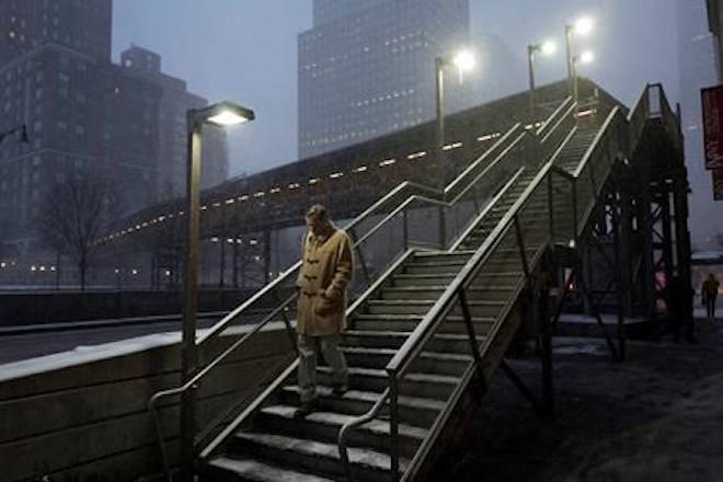 A man walks down a staircase through an early morning snowfall, Thursday, Jan. 4, 2018, in New York. Residents across a huge swath of the U.S. awakened Thursday to the beginnings of a massive winter storm expected to deliver snow, ice and high winds followed by possible record-breaking cold as it moves up the Eastern Seaboard from the Carolinas to Maine. (AP Photo/Mark Lennihan)