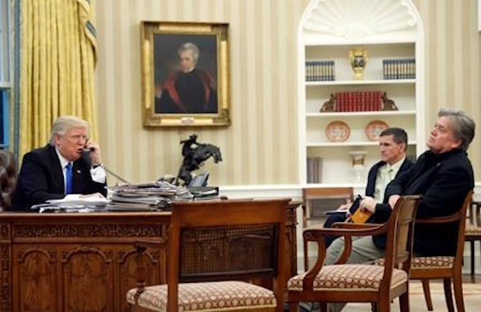 FILE - In this Jan. 28, 2017, file photo, President Donald Trump speaks on the phone with Prime Minister of Australia Malcolm Turnbull, with then-National Security Adviser Michael Flynn, center, and then- chief strategist Steve Bannon, right, in the Oval Office of the White House in Washington. Trump responded to criticism leveled at him in a new book that says he never expected ‚ or wanted, to win the White House, his victory left his wife in tears and a senior adviser thought his son’s contact with a Russian lawyer during the campaign was “treasonous.” (AP Photo/Alex Brandon, File)
