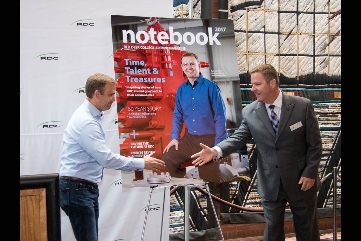 DEGREE GRANTING - Red Deer College President Joel Ward, seen here unveiling last year’s Notebook Magazine, is optimistic that the institution will be approved for degree-granting status early this year. Todd Colin Vaughan/Red Deer Express