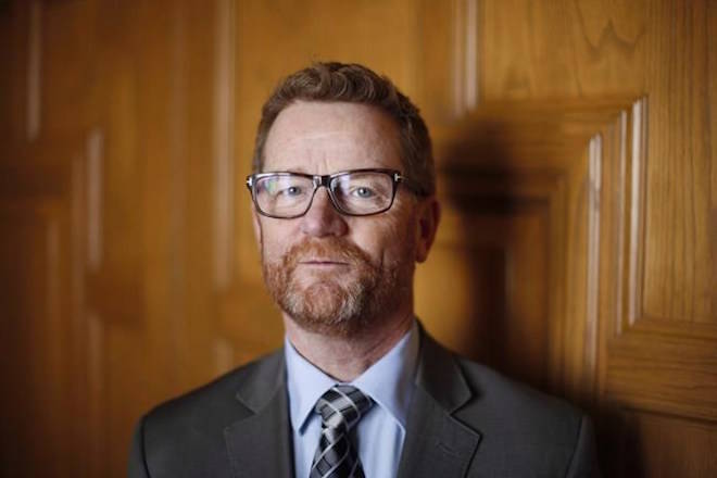 Terry Lake poses for a photo after leaving the Legislative Assembly one last time before retirement at legislature in Victoria on March 16, 2017. Lake, the former British Columbia health minister who oversaw the declaration of a public health emergency amid the deadly fentanyl crisis, is urging more research on the effects of cannabis on opioid addictions. THE CANADIAN PRESS/Chad Hipolito