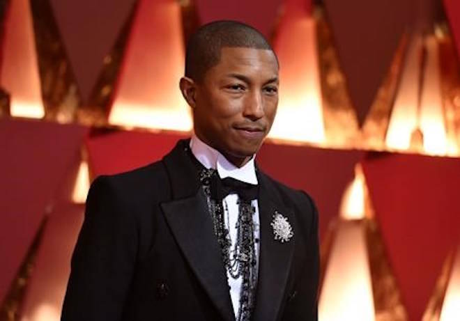FILE - In this Feb. 26, 2017, file photo, Pharrell Williams arrives at the Oscars at the Dolby Theatre in Los Angeles. The NBA announced Thursday, Jan. 18, 2018, that 11-time Grammy winner Pharrell and his hip hop-rock band N.E.R.D. will headline the halftime show at the 2018 NBA All-Star game in Los Angeles next month. (Photo by Richard Shotwell/Invision/AP, File)