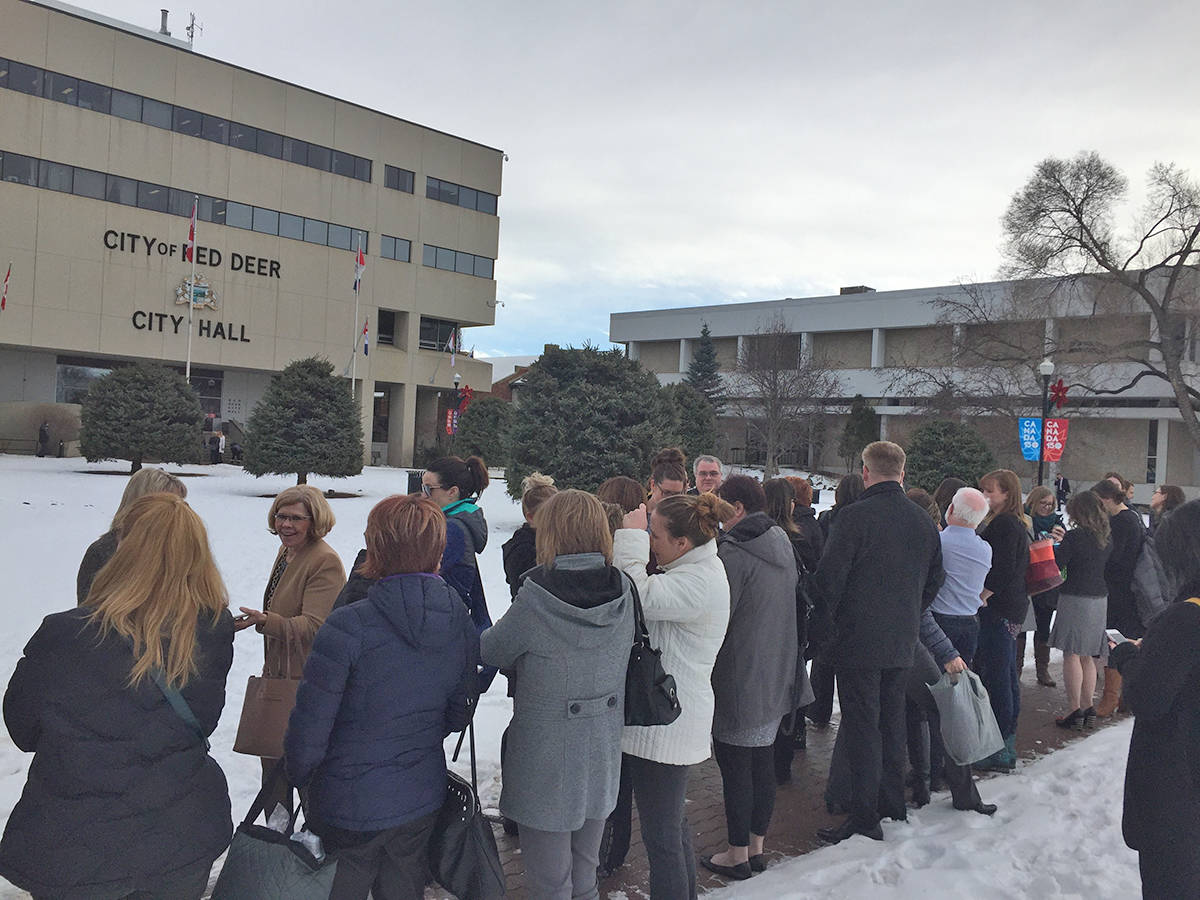 FALSE ALARM - Many City of Red Deer employees gathered outside due to concerns of carbon monoxide poisoning within the building this afternoon. Carlie Connolly/Red Deer Express