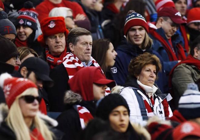 Toronto Mayor John Tory sits with fans as they wait for the start of MLS Cup Final soccer action between the Seattle Sounders and Toronto FC in Toronto on Saturday, December 9, 2017. The mayor of Canada’s most populous city says he wants Toronto to be among the North American cities to co-host the 2026 FIFA World Cup. THE CANADIAN PRESS/Mark Blinch