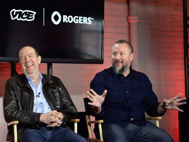 Vice co-founder and CEO Shane Smith (right) gestures as Rogers Communications President and CEO Guy Laurence laughs during an announcement in Toronto on Thursday October 30, 2014. Rogers Media and Vice Canada are ending their three-year-old partnership with the result that TV channel Viceland will cease broadcasting on Rogers cable as of March 31 and Rogers will give up its interest in Vice Studio Canada. THE CANADIAN PRESS/Nathan Denette