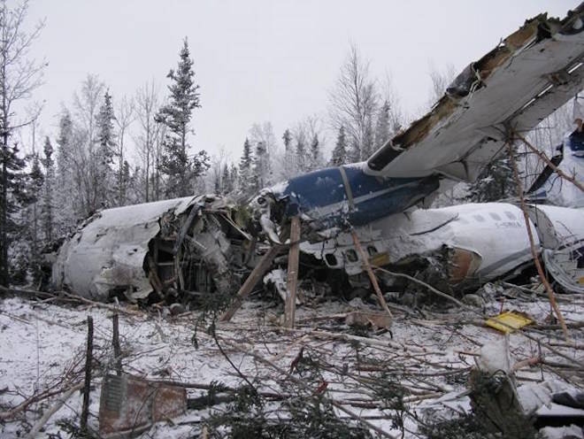 The wreckage of an aircraft is seen near Fond du Lac, Sask. on Thursday, December 14, 2017 in a handout photo. THE CANADIAN PRESS/Transportation Safety Board of Canada Handout