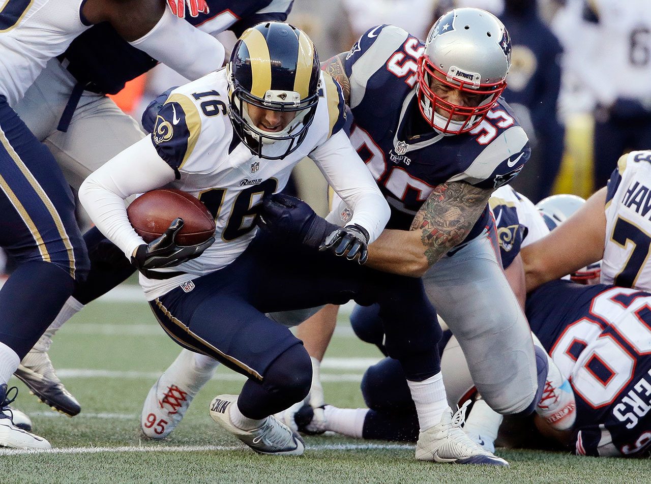 New England Patriots defensive end Chris Long (95) sacks Los Angeles Rams quarterback Jared Goff (16) during the second half of an NFL football game, Sunday, Dec. 4, 2016, in Foxborough, Mass. (Elise Amendola/AP Photo)