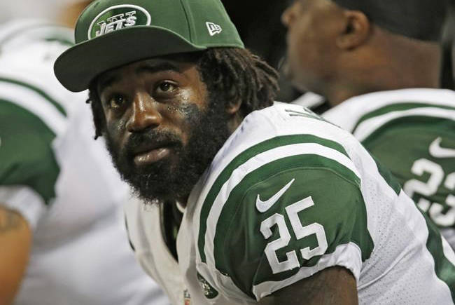 FILE- In this Nov. 18, 2012, file photo, New York Jets’ Joe McKnight (25) sits on the sideline during the fourth quarter of an NFL football game against the St. Louis Rams in St. Louis. Closing argument are expected Friday, Jan. 26, 2018 in the murder trial of Ronald Gasser, who is accused of killing Knight in a road rage incident. (Tom Gannam/AP File)