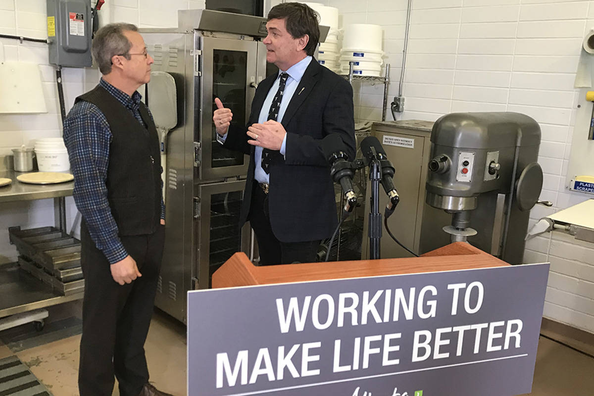 (L-R) Paul Flesher, president of Crust Craft Inc in Edmonton talks with Alberta Agriculture and Forestry minister Oneil Carlier about the $81 million in funding for expanded energy efficiency programs for the entire ag sector. Image: Government of Alberta