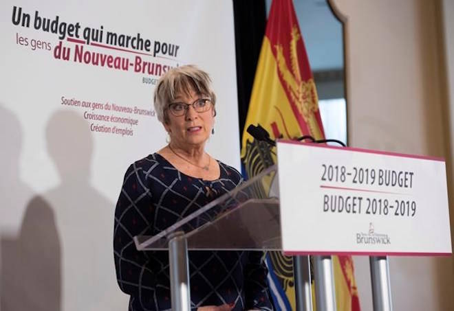 New Brunswick Finance Minister Cathy Rogers speaks at a press conference prior to delivering the provincial budget in the Legislature in Fredericton, N.B., on Tuesday, January 30, 2018.Stephen MacGillivray / THE CANADIAN PRESS