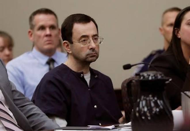 FILE - In this Jan. 24, 2018, file photo, Larry Nassar sits during his sentencing hearing in Lansing, Mich. The House has followed up on the sex abuse scandal involving Nassar with the passage of legislation that requires governing bodies for amateur athletics to promptly report claims of abuse to law enforcement. (AP Photo/Carlos Osorio, File)