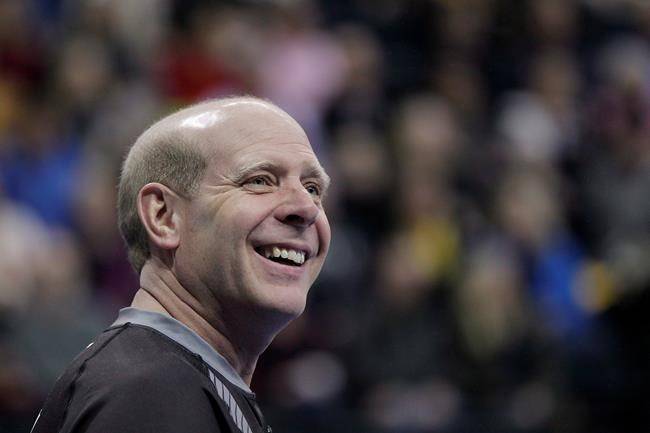 Skip Kevin Martin smiles during the first end of the men’s semifinal against John Morris at the 2013 Roar of the Rings Canadian Olympic Curling Trials in Winnipeg on Dec. 7, 2013. (John Woods/The Canadian Press)