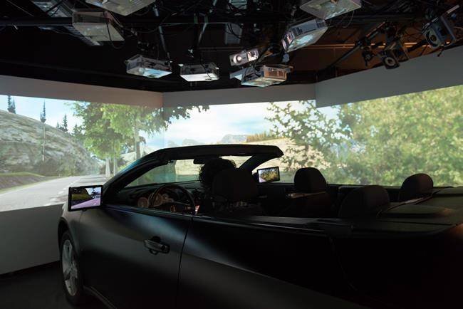 Benjamin Cortens, a computer science graduate student at the University of Guelph, is at the school’s DRIVE lab on Wednesday. (Hannah Yoon/The Canadian Press)