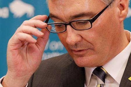 Then-Manitoba finance minister Stan Struthers pauses during a news conference at the provincial legislature in Winnipeg in 2013. (John Woods/The Canadian Press)