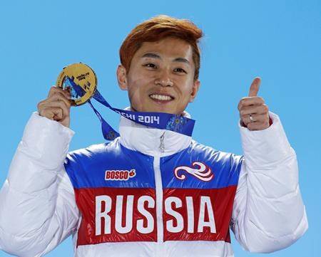 In this Feb. 15, 2014, file photo, men’s 1,000-meter short track speedskating gold medalist Viktor Ahn, of Russia, gestures while holding his medal during the medals ceremony at the Winter Olympics in Sochi, Russia. (AP Photo/David J. Phillip, File)