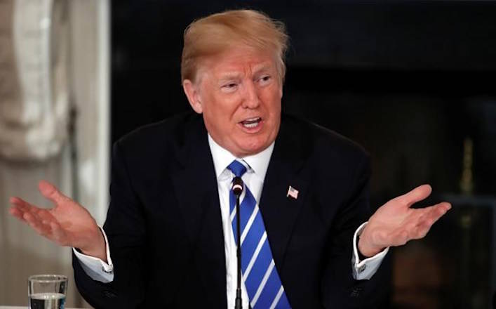 President Donald Trump speaks during a meeting with state and local officials about infrastructure in the State Dining Room of the White House in Washington, Monday, Feb. 12, 2018. (AP Photo/Carolyn Kaster)