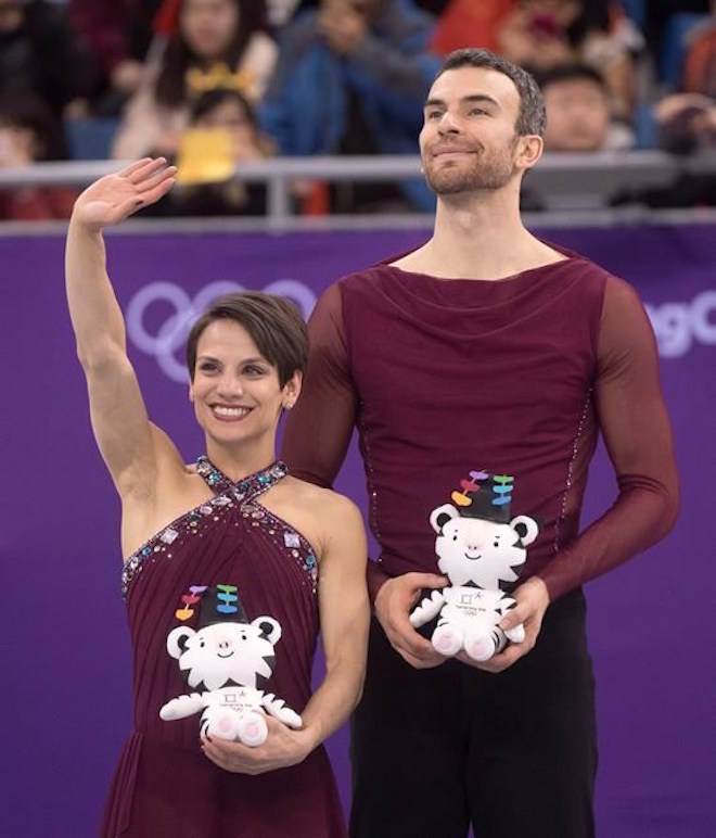 Pairs figure skating bronze medallists Canada’s Meagan Duhamel and Eric Radford wave from the podium during victory ceremonies at the Pyeonchang Winter Olympics Thursday, February 15, 2018 in Gangneung, South Korea. THE CANADIAN PRESS/Paul Chiasson