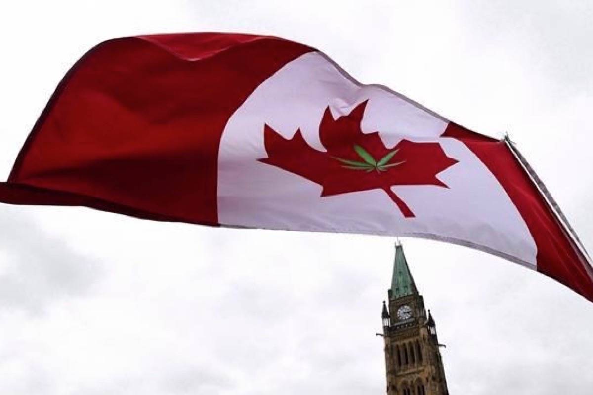 A Canadian flag with a marijuana leaf on it flies during a 4/20 rally on Parliament Hill in Ottawa on April 20, 2017. (Sean Kilpatrick/The Canadian Press)
