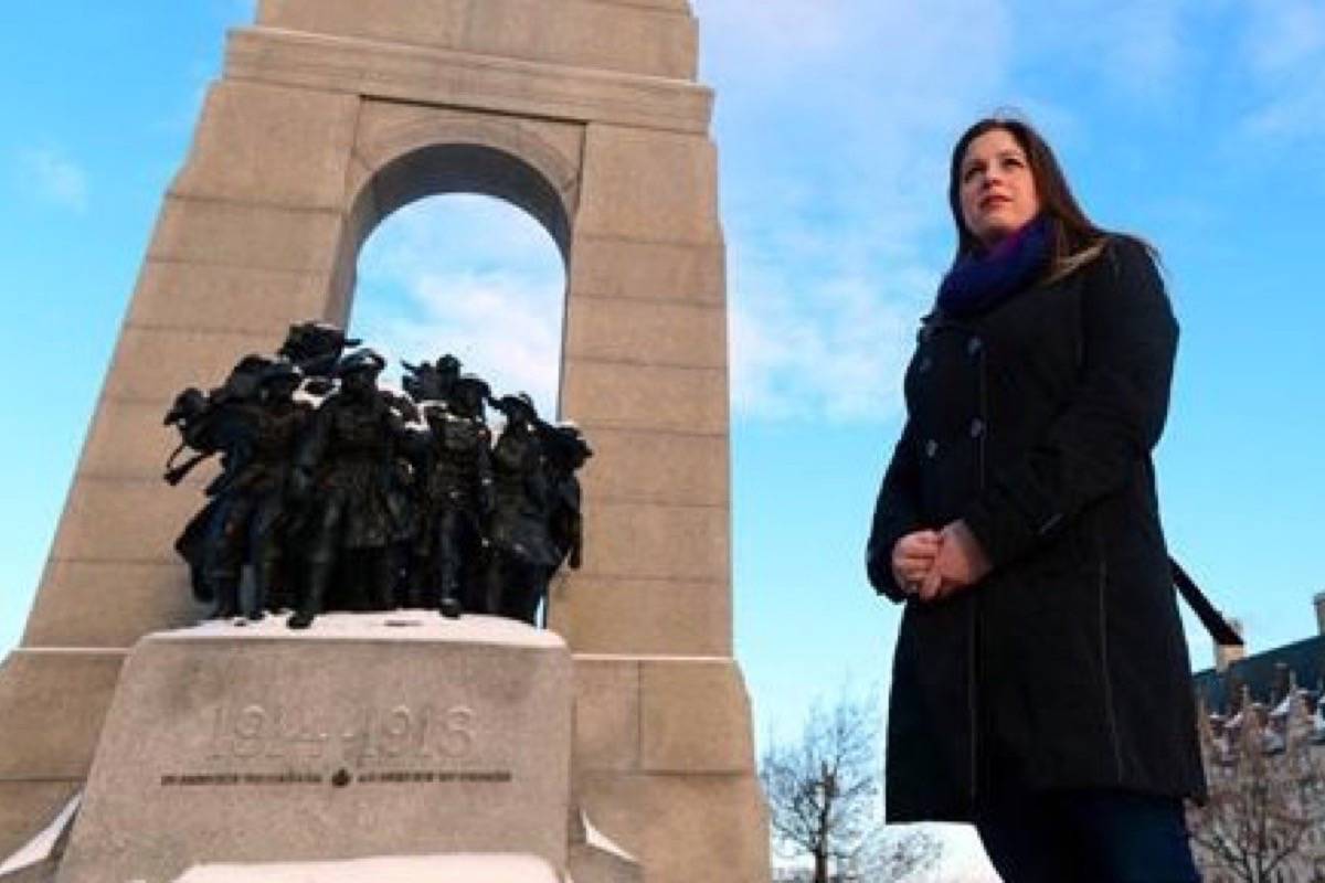 Sarah Lockyer, who works for National Defence, stands at the National War Memorial in Ottawa. (Sean Kilpatrick/The Canadian Press)