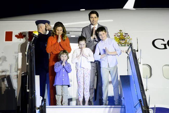 Prime Minister Justin Trudeau, wife Sophie Gregoire Trudeau, and children, Xavier, 10, Ella-Grace, 9, and Hadrien, 3, arrive in New Delhi on Saturday. (Sean Kilpatrick/The Canadian Press)
