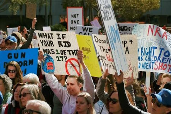 Protestors join in on a grassroots movement during a rally against gun violence in downtown Los Angeles on Monday, Feb. 19, 2018, in the wake of last week’s school shooting in Parkland, Florida. (AP Photo/Richard Vogel)