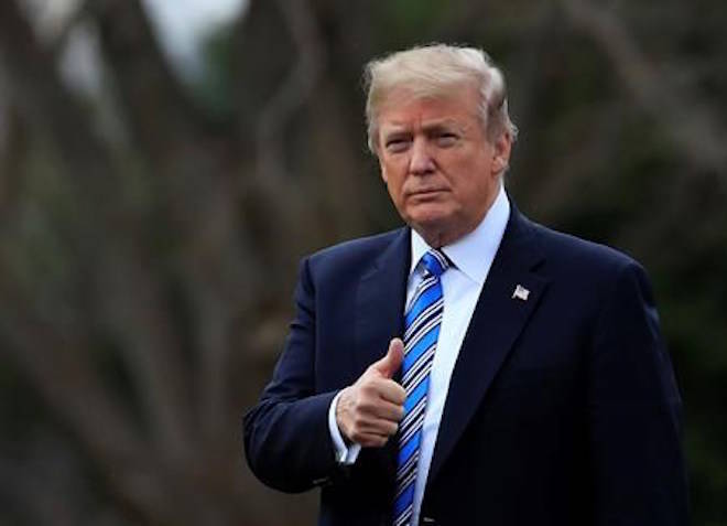 President Donald Trump gestures as he walks as he leaves the White House, Friday, Feb. 16, 2018, in Washington, for a trip to his private Mar-a-Lago resort in Florida. (AP Photo/Manuel Balce Ceneta)