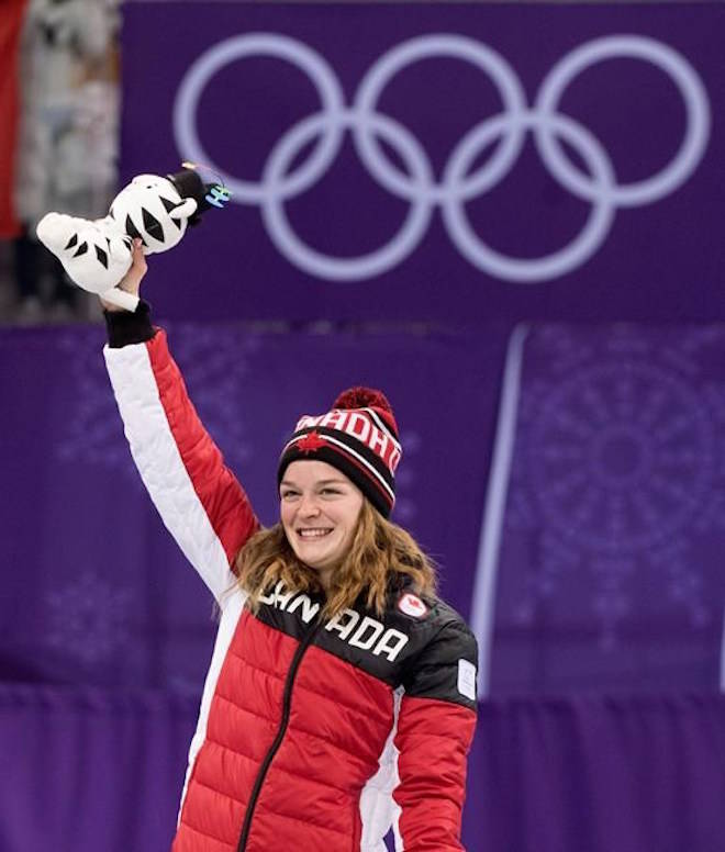 Women’s 1,000-metre short-track speedskating silver medalist Kim Boutin waves from the podium during victory ceremonies at the Pyeongchang Winter Olympics Thursday, February 22, 2018 in Gangneung, South Korea. THE CANADIAN PRESS/Paul Chiasson
