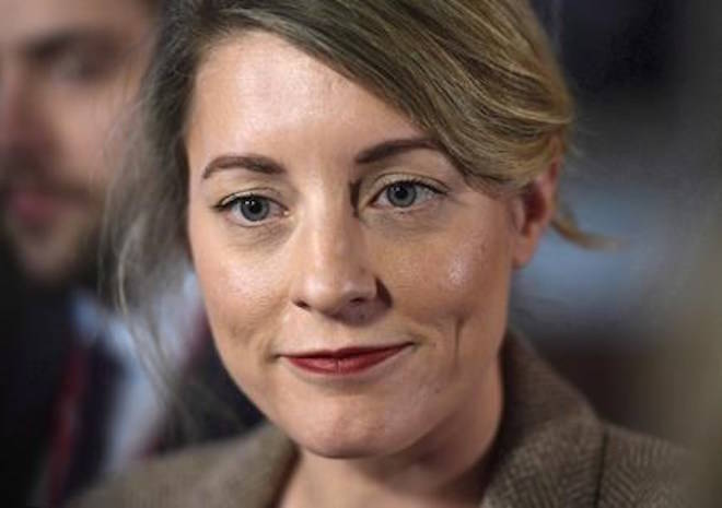 Minister of Canadian Heritage Melanie Joly speaks to reporters after leaving a cabinet meeting on Parliament Hill in Ottawa on February 6, 2018. THE CANADIAN PRESS/Justin Tang