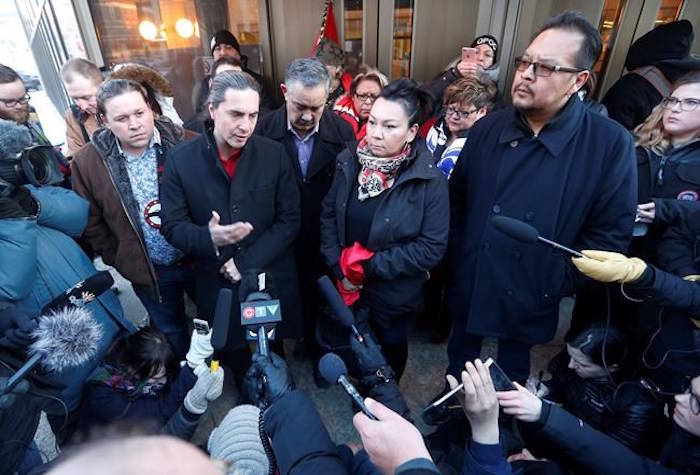 From left, Grand Chief Jerry Daniels, Southern Chiefs’ Organization, Chief Arlen Dumas, Chief Derrick Henderson of Sagkeeng, Chief Sheila North, and Chief Kevin Hart speak to media outside the law courts in Winnipeg after the jury delivered a not-guilty verdict in the second degree murder trial of Raymond Cormier, Thursday, February 22, 2018. THE CANADIAN PRESS/John Woods