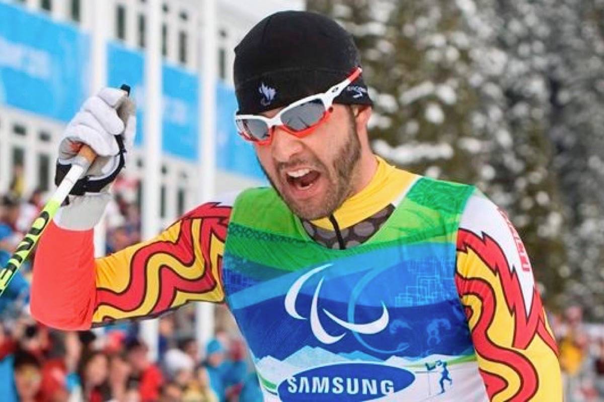 Canadian Brian McKeever celebrates his gold medal win in the men’s 20 km free, visually impaired cross country ski race at the 2010 Winter Paralympic Games in Vancouver. (Jonathan Hayward/The Canadian Press)