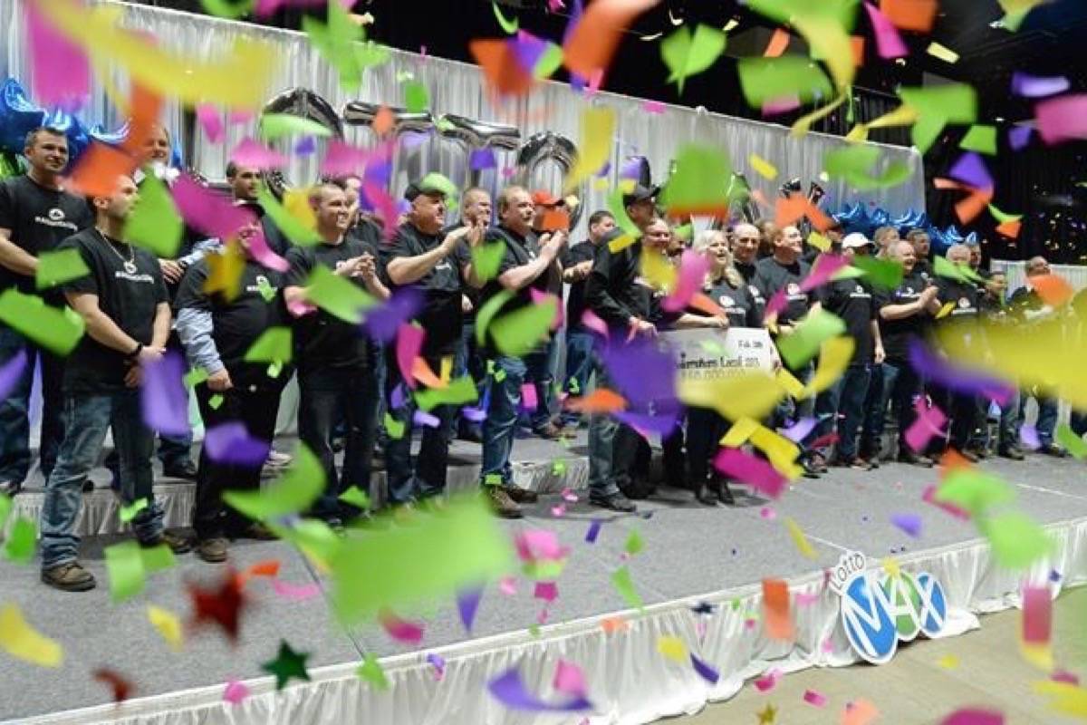 Thirty-one members of the Boilermakers Local 203 at the North Atlantic oil refinery in Come By Chance, N.L., collected their shares of a $60 million Lotto Max jackpot Wednesday in St. John’s. (Keith Gosse/The Canadian Press)