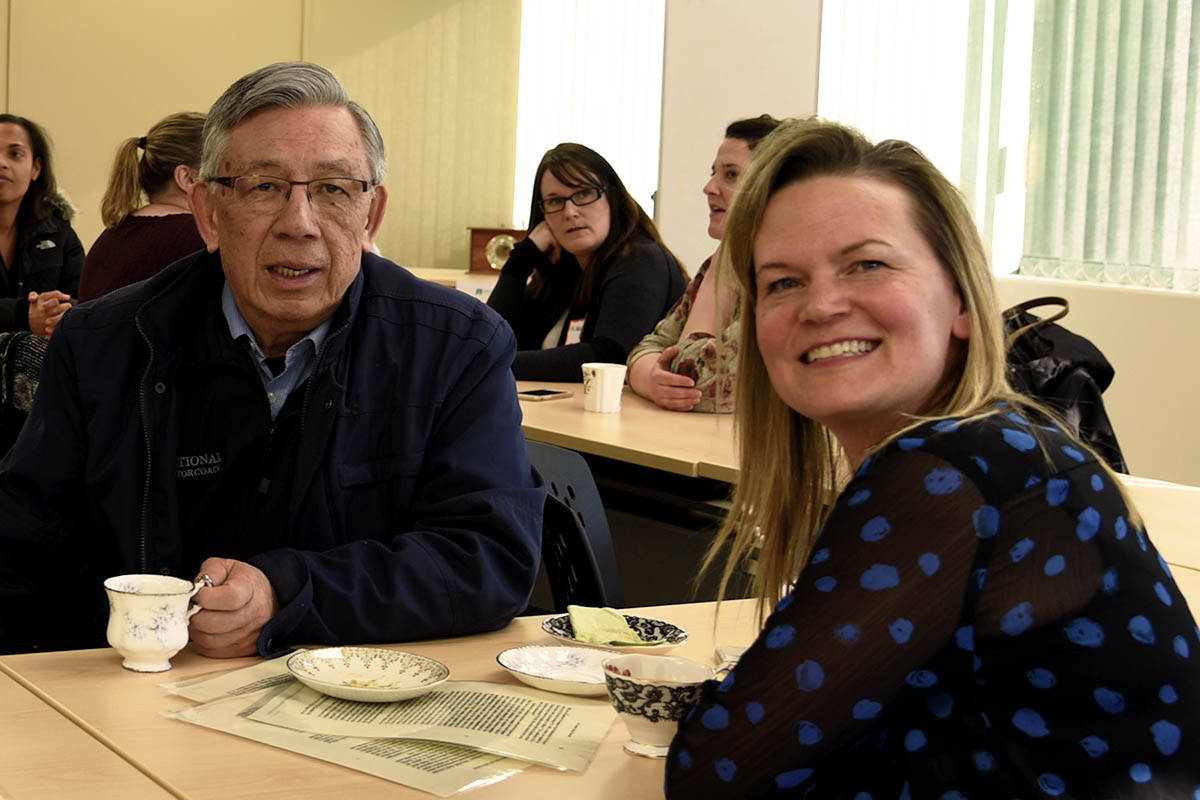 CENTENNIAL CELEBRATION - Christine Stewart, executive director of the Central Alberta Canadian Mental Health Association chats with City Councillor Frank Wong at a tea celebrating the CMHA’s 100th anniversary last week. Michelle Falk/Red Deer