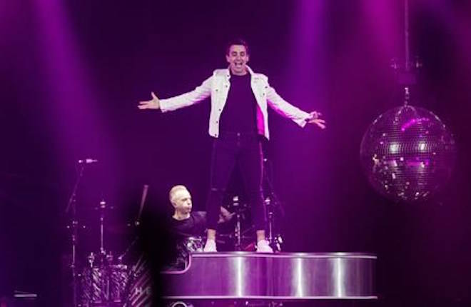 Jacob Hoggard, right, frontman for the rock group Hedley, performs during the band’s concert in Halifax on Friday, February 23, 2018. THE CANADIAN PRESS/Darren Calabrese