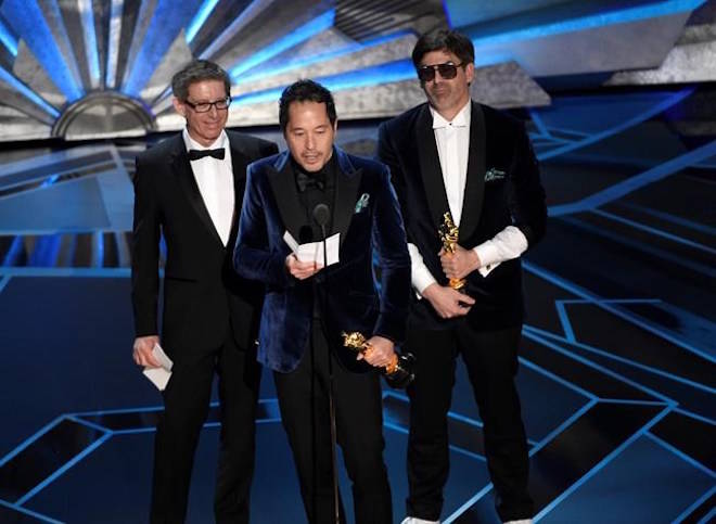 Jeffrey A. Melvin, from left, Paul Denham Austerberry, and Shane Vieau accept the award for best production design for “The Shape of Water” at the Oscars on Sunday, March 4, 2018, at the Dolby Theatre in Los Angeles. (Photo by Chris Pizzello/Invision/AP)