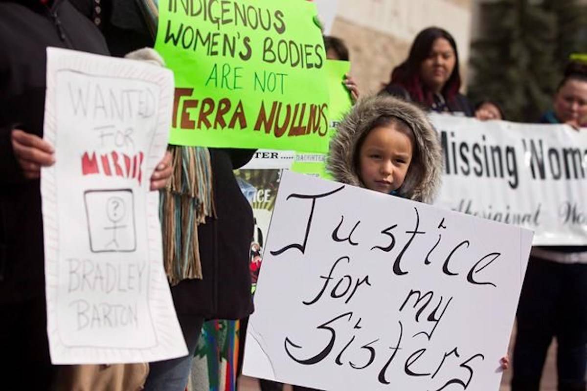 Protesters hold signs outside city hall in support of Cindy Gladue in Edmonton on April 2, 2015. The Supreme Court of Canada will hear an appeal in the case of an Ontario trucker acquitted of murdering an Indigenous woman in an Edmonton motel room. In March 2015, Bradley Barton was found not guilty by a jury in the death of Cindy Gladue, a sex-trade worker whose body was found in a bathtub. THE CANADIAN PRESS/Topher Seguin