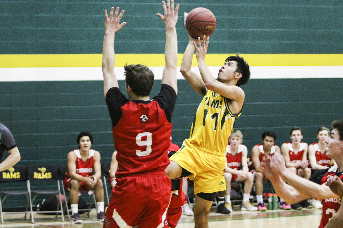 BIG WIN - John Rick Tubungbanua and the Lacombe Rams stayed alive in their 4A City Championship final against the Lindsey Thurber Raiders, winning 74-67 on their home court. Todd Colin Vaughan/Red Deer Express