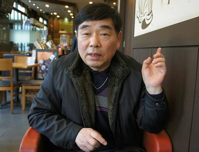 In this Jan. 29, 2018, photo, Kim Paolo speaks during an interview in Bucheon, South Korea. When South Korea previously held the Olympics in 1988, Kim Paolo and some 150 other poor urban residents spent months that year hiding in huge graves of their own making. They were the last among thousands ousted from host city Seoul after losing years-long pre-Olympic battles against officials, police, construction workers and hired thugs. A massive effort to beautify the capital had razed hundreds of poor neighborhoods to make way for new high-rise buildings. In violent clashes between residents and police, several died and hundreds were injured. (AP Photo/Kim Tong-hyung)