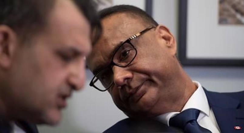 Jaspal Atwal, right, speaks to his lawyer Rishi T. Gill during a news conference in downtown Vancouver, on Thursday, March, 8, 2018. Atwal said Thursday that since he was convicted of trying to kill an Indian cabinet minister in 1986, he has tried to contribute to Canadian society and those efforts include meeting politicians from various parties. THE CANADIAN PRESS/Jonathan Hayward