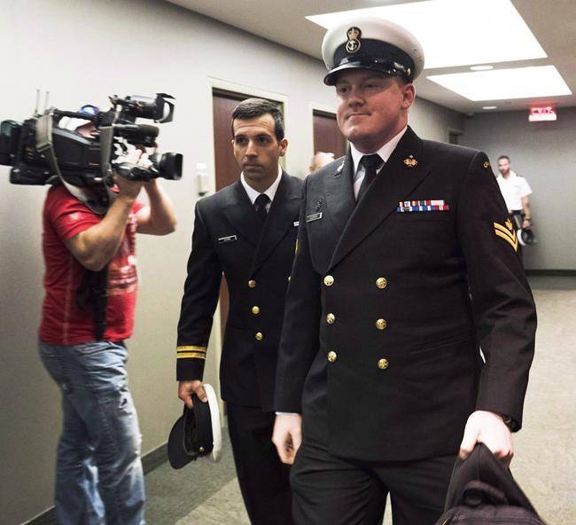 Master Seaman Daniel Cooper’s hearing was scheduled to resume Thursday afternoon, but a nor’easter knocked out power to the building that houses the military court, so proceedings will resume Friday. Accused Master Seaman Daniel Cooper, right, arrives for his standing court martial case in Halifax on Tuesday Sept. 26, 2017. THE CANADIAN PRESS/Ted Pritchard