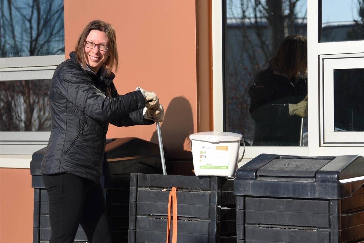 BACKYARD COMPOST PROGRAM - Lauren Maris, environmental program specialist for the City of Red Deer, aerates compost at the Civic Yards.                                Michelle Falk/Red Deer Express
