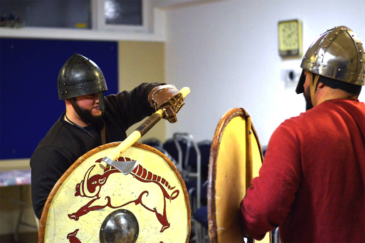 EPIC BATTLE - Gonzalo Franco-Mancebob and Brad Cotmen, leader of the Heimdall’s Spears, practise reinacting historically acurate Viking sword fighting at their first meeting in their new venue, St. Leonard’s Anglican Church.                                 Photo supplied by Annika deKlerk
