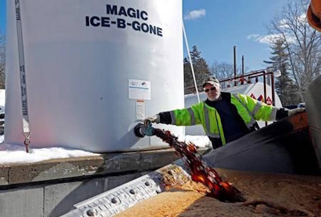 David Osgood, crew leader of the public works dept., fills the bucket of a front-end loader with “Ice-B-Gone,” Monday, March 12, 2018, in Freeport, Maine. The liquid, a by-product of vodka, is mixed with road salt stick for better adhesion to the road. Much of the Northeast is bracing for blizzard conditions, a foot or more of snow and high winds as the third major nor’easter in 10 days bears down on the region. (AP Photo/Robert F. Bukaty)