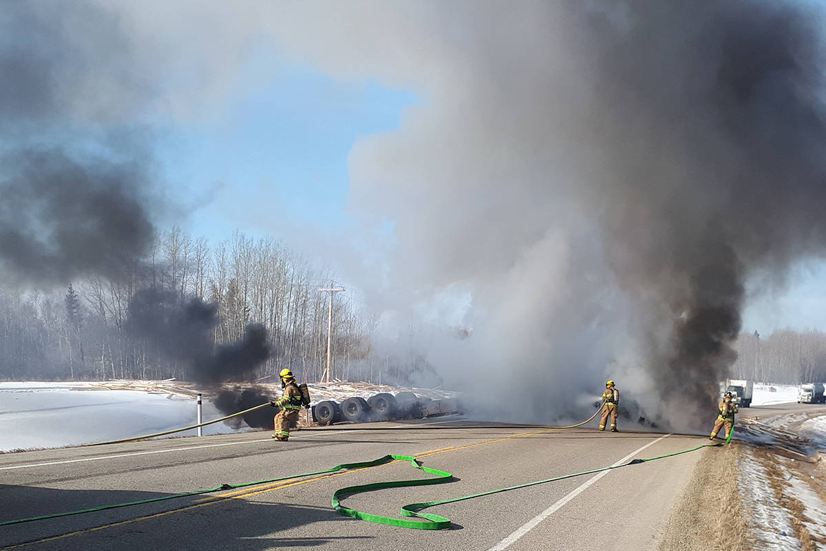 A semi tractor hauling lumber Wednesday morning near Breton rolled and caught on fire. The driver was uninjured but the incident has caused major delays on that stretch of road say RCMP.                                RCMP photo