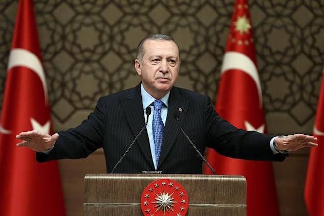 Turkey’s President Recep Tayyip Erdogan, gestures as he delivers a speech during a rally in Ankara, Turkey, Wednesday, March 14, 2018. Erdogan expressed hope the Syrian town of Afrin will be encircled by its forces by Wednesday evening, after launching its assault on the Afrin enclave on Jan. 20 to drive out Syrian Kurdish forces. (Kayhan Ozer/Pool Photo via AP)